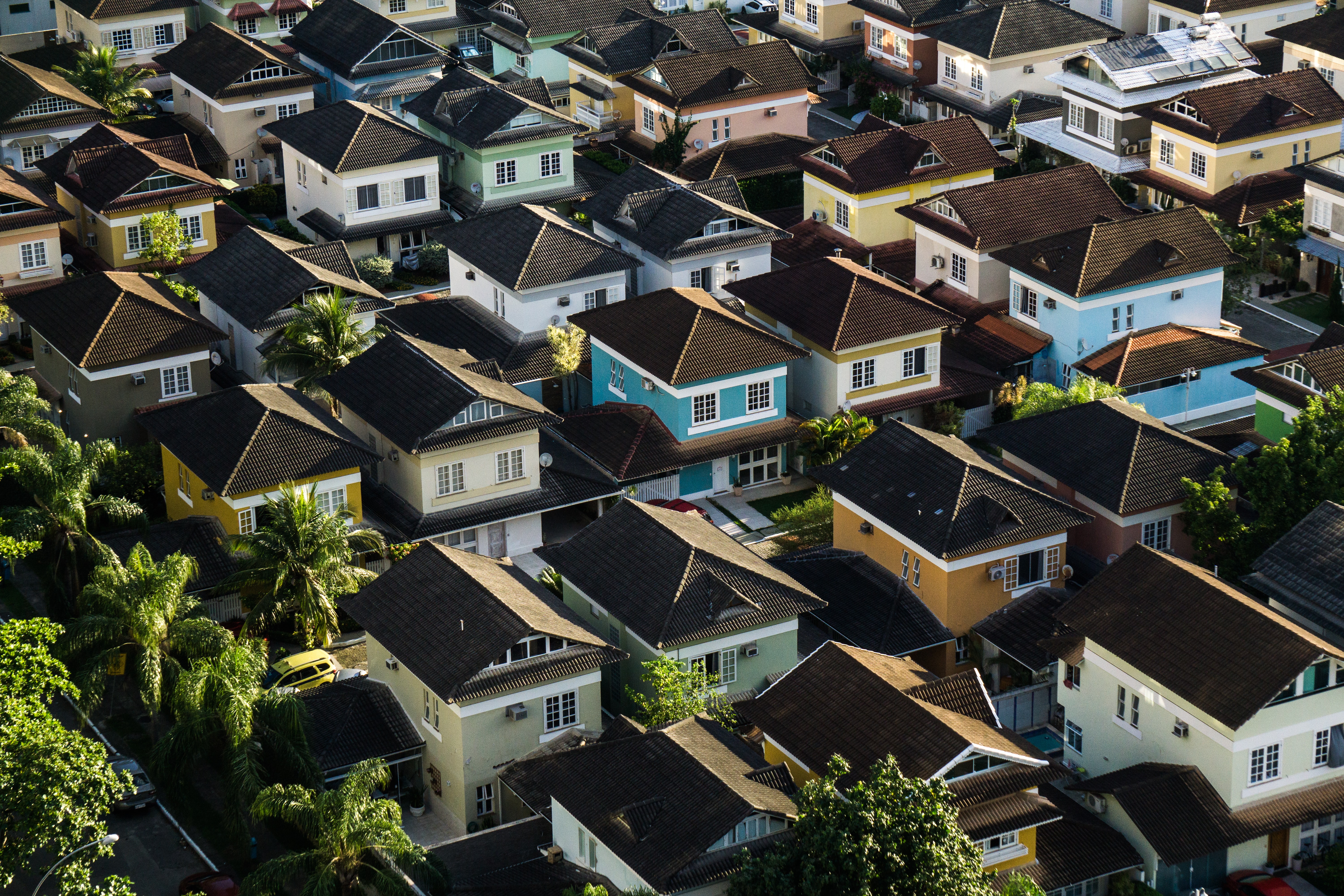 Arial shot of house rooftops - Photo by Breno Assis on Unsplash